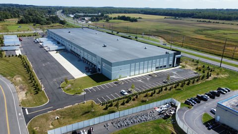 Aerial view of a large modern industrial warehouse with many loading docks. | Down To Earth Landscaping | Jackson New Jersey, USA (732) 833-7702