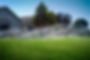 Automatic sprinklers watering a lush green lawn in front of a house. | Down To Earth Landscaping | Jackson New Jersey, USA (732) 833-7702