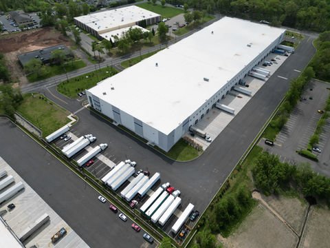 Aerial view of large distribution center with numerous semi-trucks parked. | Down To Earth Landscaping | Jackson New Jersey, USA (732) 833-7702