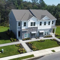 New modern grey and white duplex house, lush green lawn. | Down To Earth Landscaping | Jackson New Jersey, USA (732) 833-7702