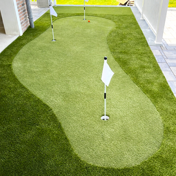 Backyard Artificial Turf putting green, flags, red ball, and water background. | Down To Earth Landscaping | Jackson New Jersey, USA (732) 833-7702