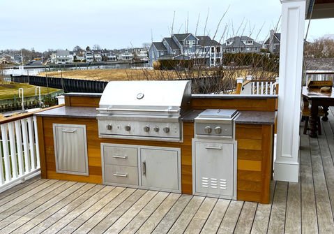 Luxurious outdoor grill kitchen on deck with waterfront residential view. Residential landscaping near me| Down To Earth Landscaping | Jackson New Jersey, USA (732) 833-7702