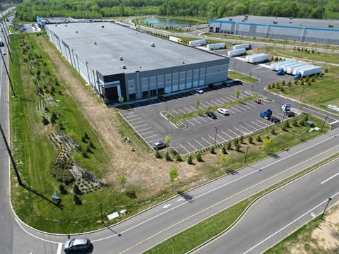 Aerial view of a large commercial warehouse with parking lot and trucks. | Down To Earth Landscaping | Jackson New Jersey, USA (732) 833-7702