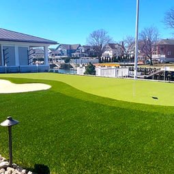 Pristine backyard putting green, sand bunker, and canal-side gazebo. | Down To Earth Landscaping | Jackson New Jersey, USA (732) 833-7702