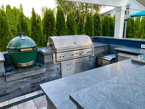 Modern outdoor kitchen with built-in stainless steel grill, green egg smoker. Residential landscaping near me| Down To Earth Landscaping | Jackson New Jersey, USA (732) 833-7702