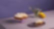 Delicious lemon meringue pie, one slice removed, lemons and flowers nearby